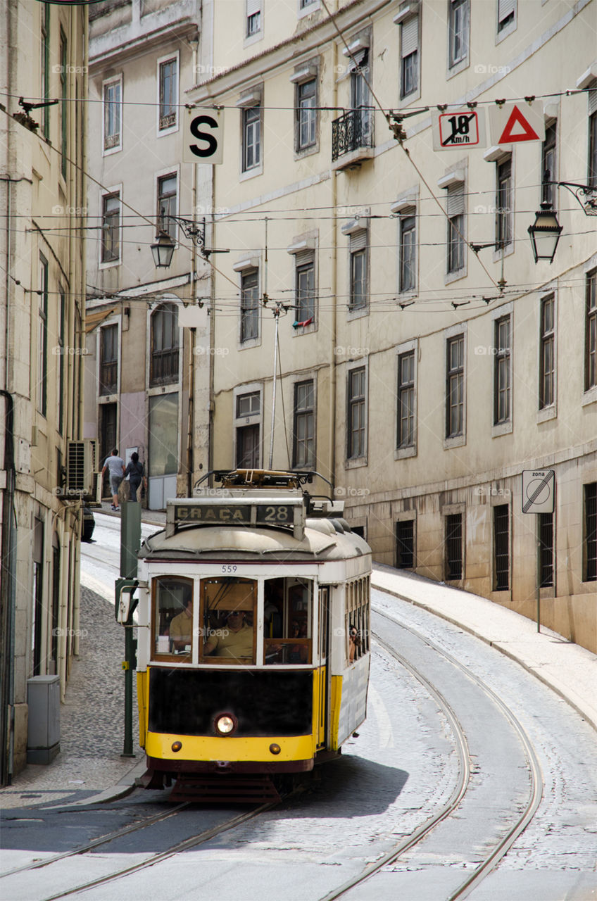 An old tram in the historic center of Lisbon, Portugal 