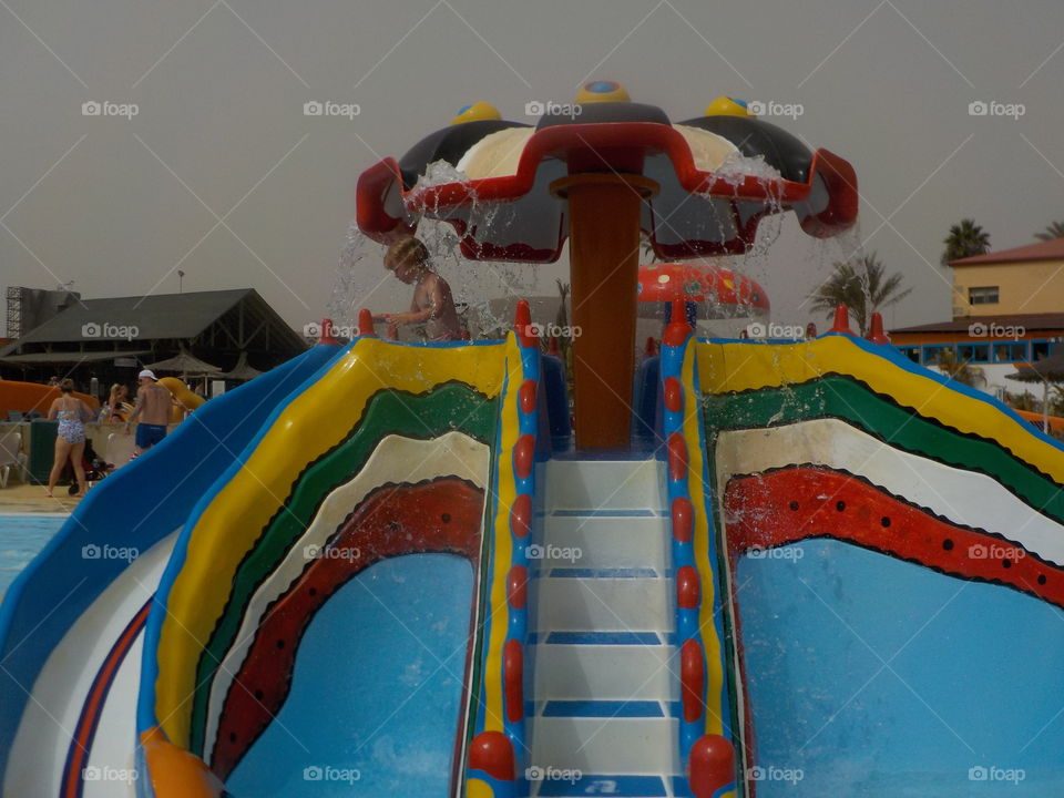 Water slide on a sand in the sky day