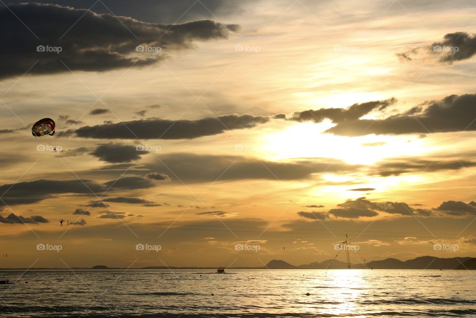 parasailing at sunset