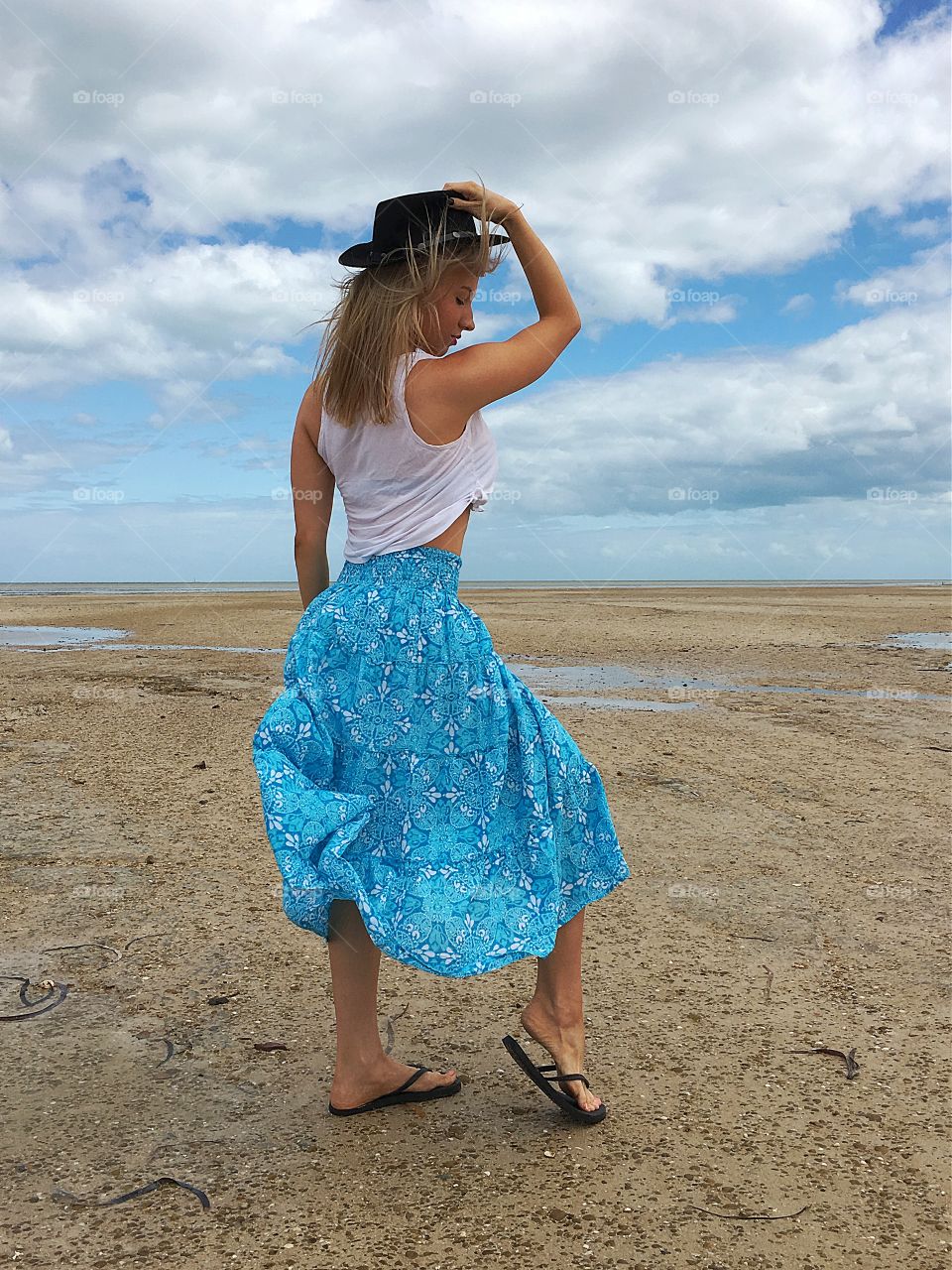 Woman with hat outdoors