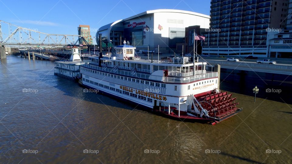 Belle of Louisville docked in Downtown Louisville after the flood of 2018. KFC Yum Center in the background.