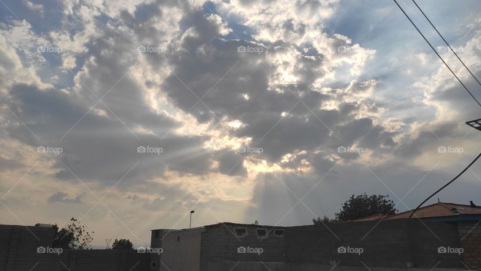 sunbbeams throughout the clouds