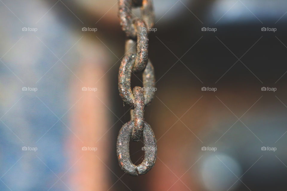 A rusty chain hanging outside