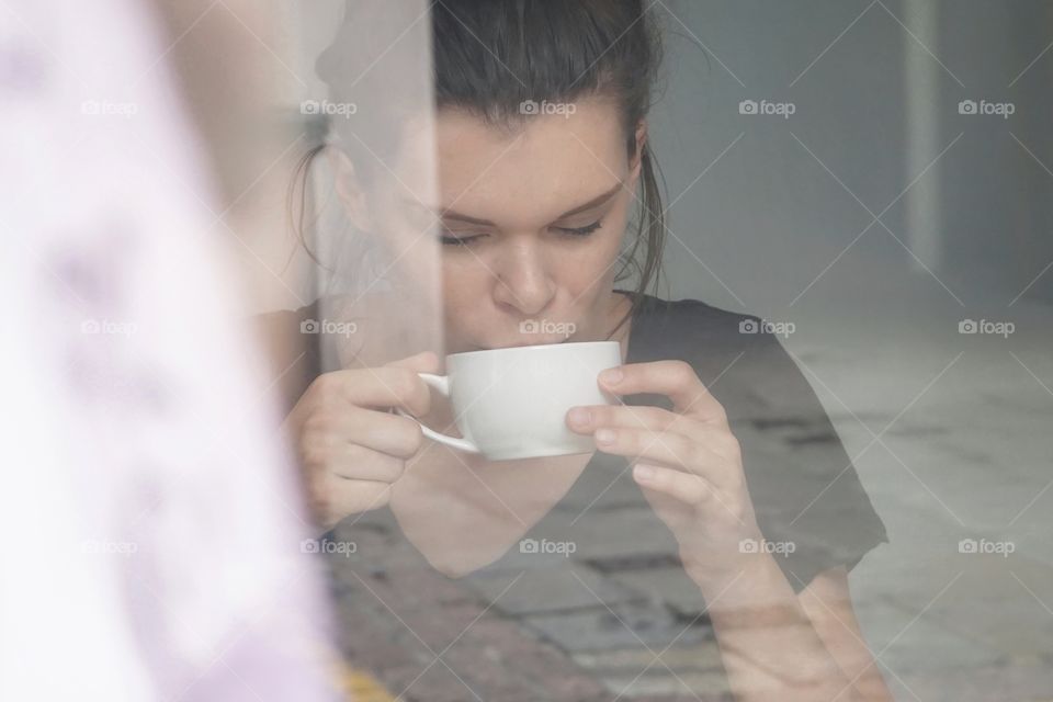 Looking through a shop window to create a softer  arty look .. enjoying a sip of coffee ☕️