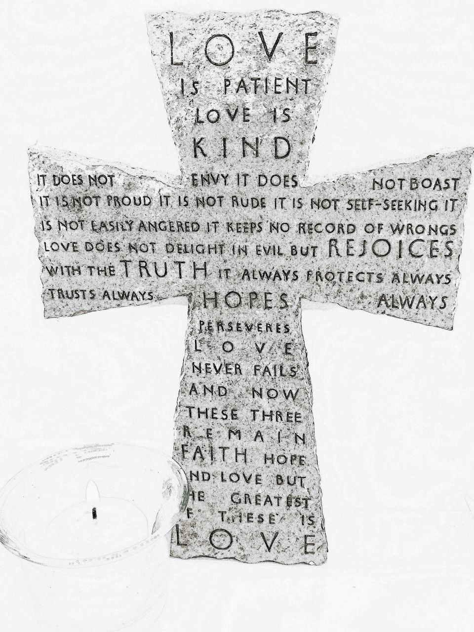 Crucifix with candle in the side, quotation is engraved in the cross about love