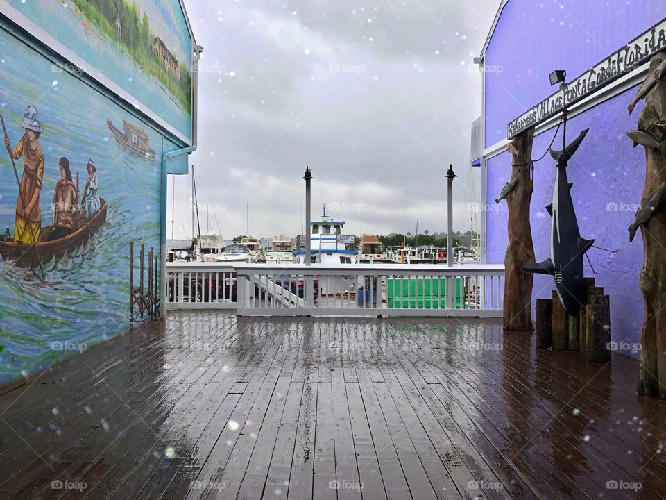 A beautiful view of the marina on a stormy day.