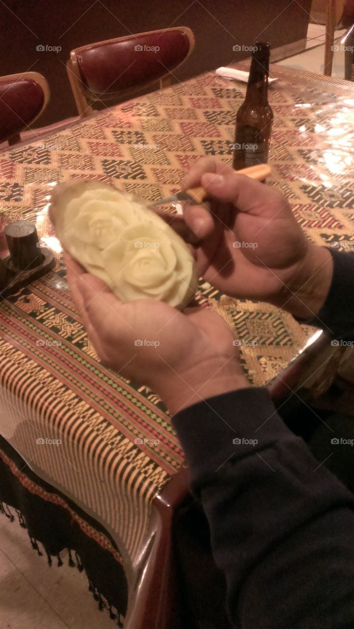 Chef Carving Potato Into Roses