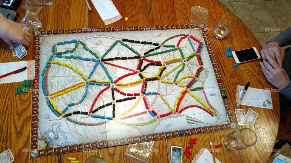 Playing Ticket to Ride Board Game with Friends and Family