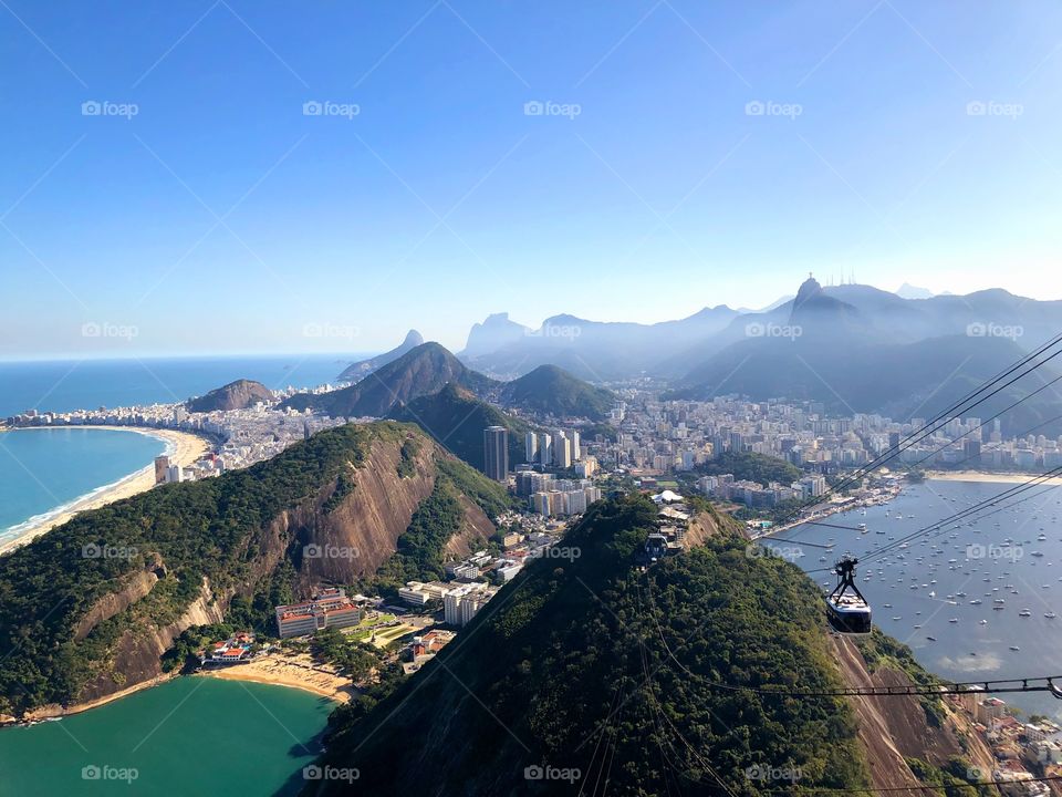 A view of the Pao de Açucar in Rio de Janeiro. a beautiful view of the city of Rio de Janeiro being seen from one of the city's tourist spots