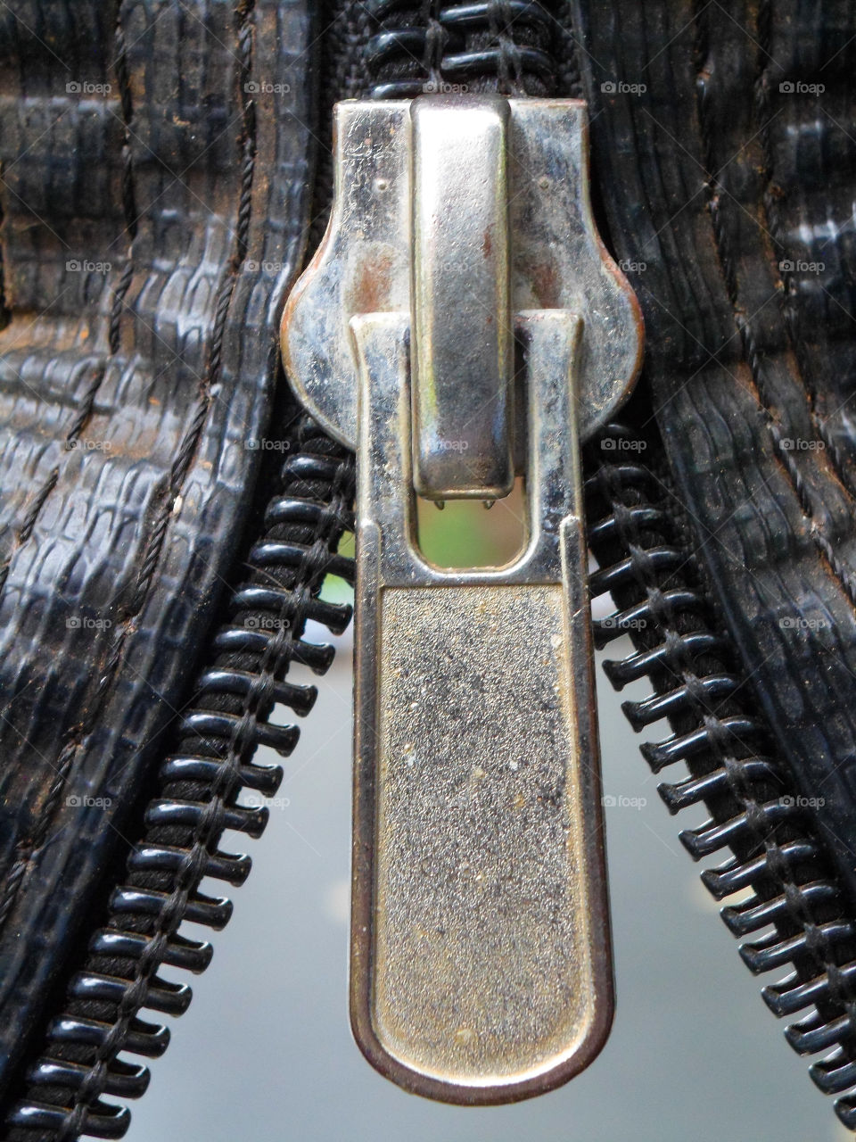 zipper on black plastic