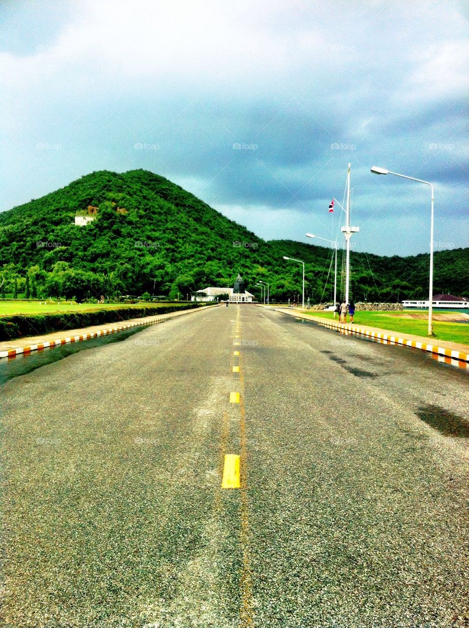 Road near the ocean and mountain