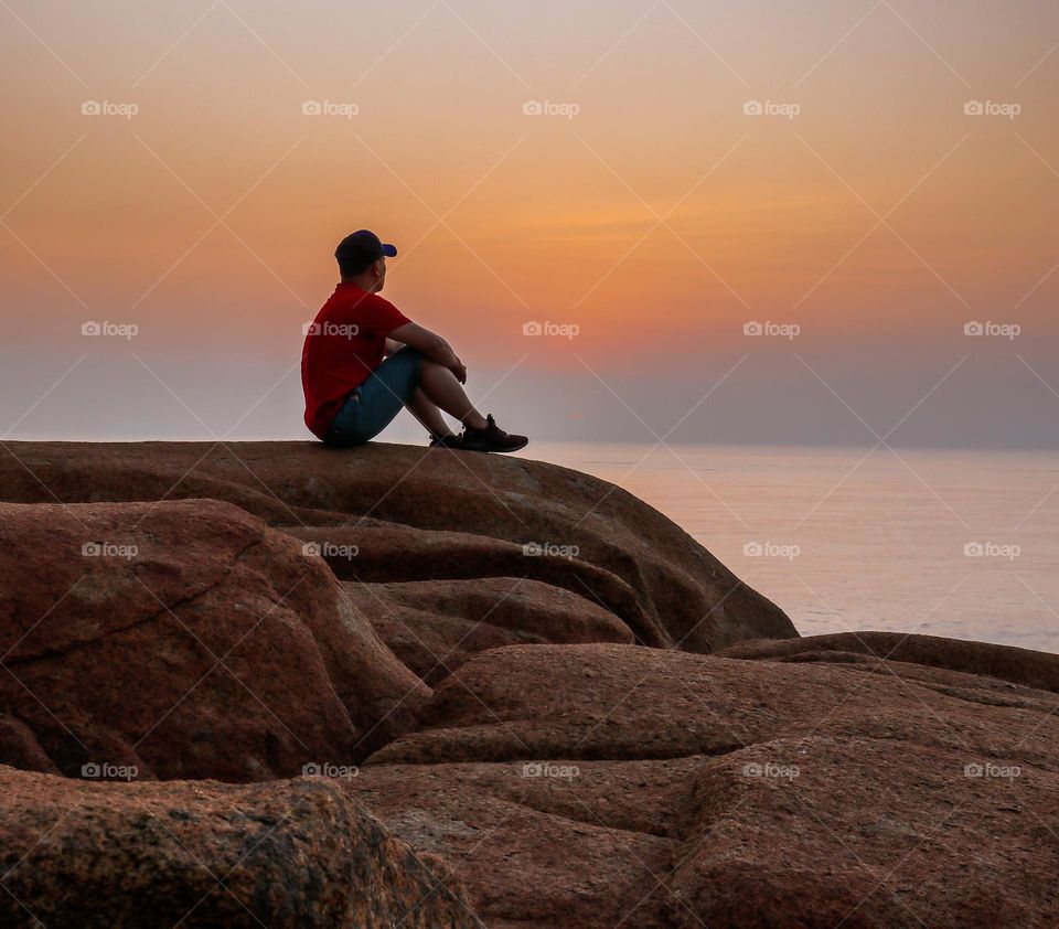 Sitting Alone while Observing sunrise