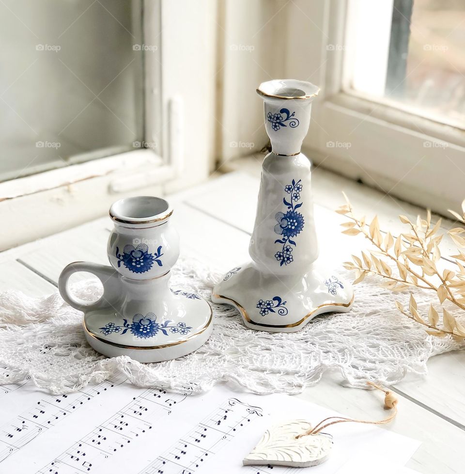 Antique porcelain candlestick’s set with blue ornament