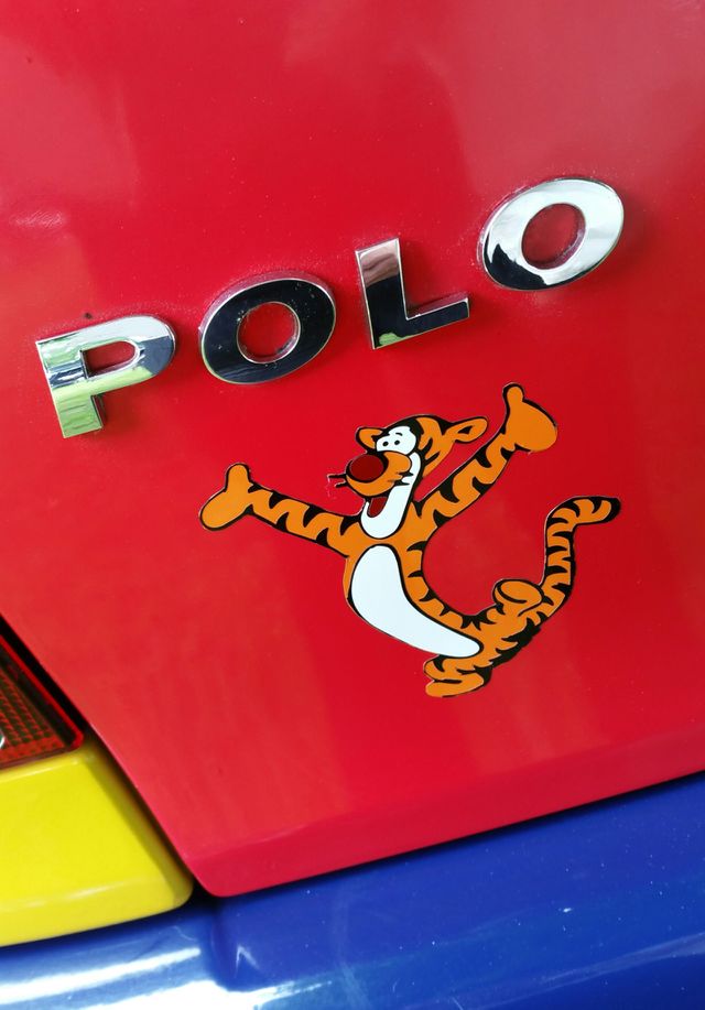 multi coloured humorously funny Volkswagen Polo
badge & tiger.