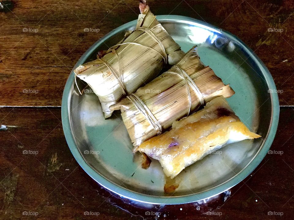 Local dessert from southern Thailand made of grilled sticky rice stuffed with banana