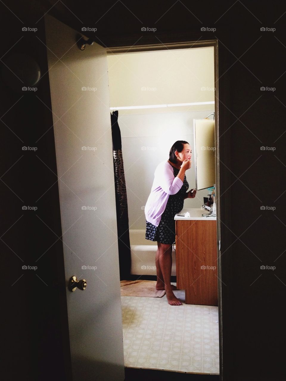 Woman Applying Cosmetics