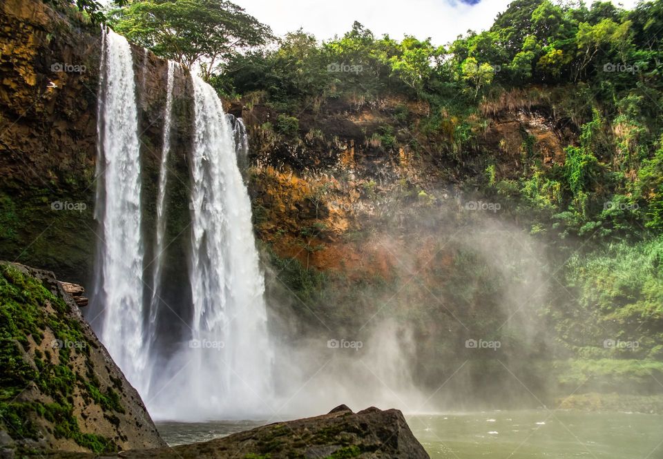 beautiful waterfall view in the middle of the forest