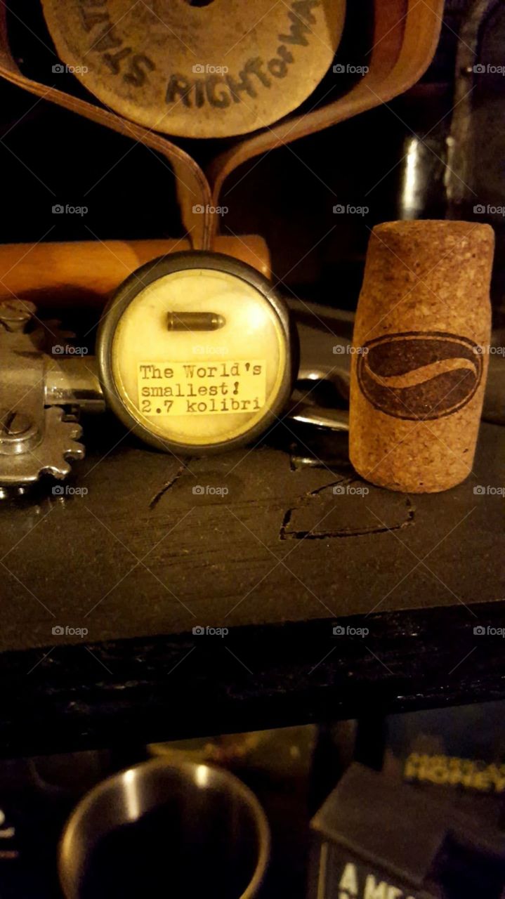 The world's smallest 2.7 kolibri, saved as decoration, alongside a wine cork