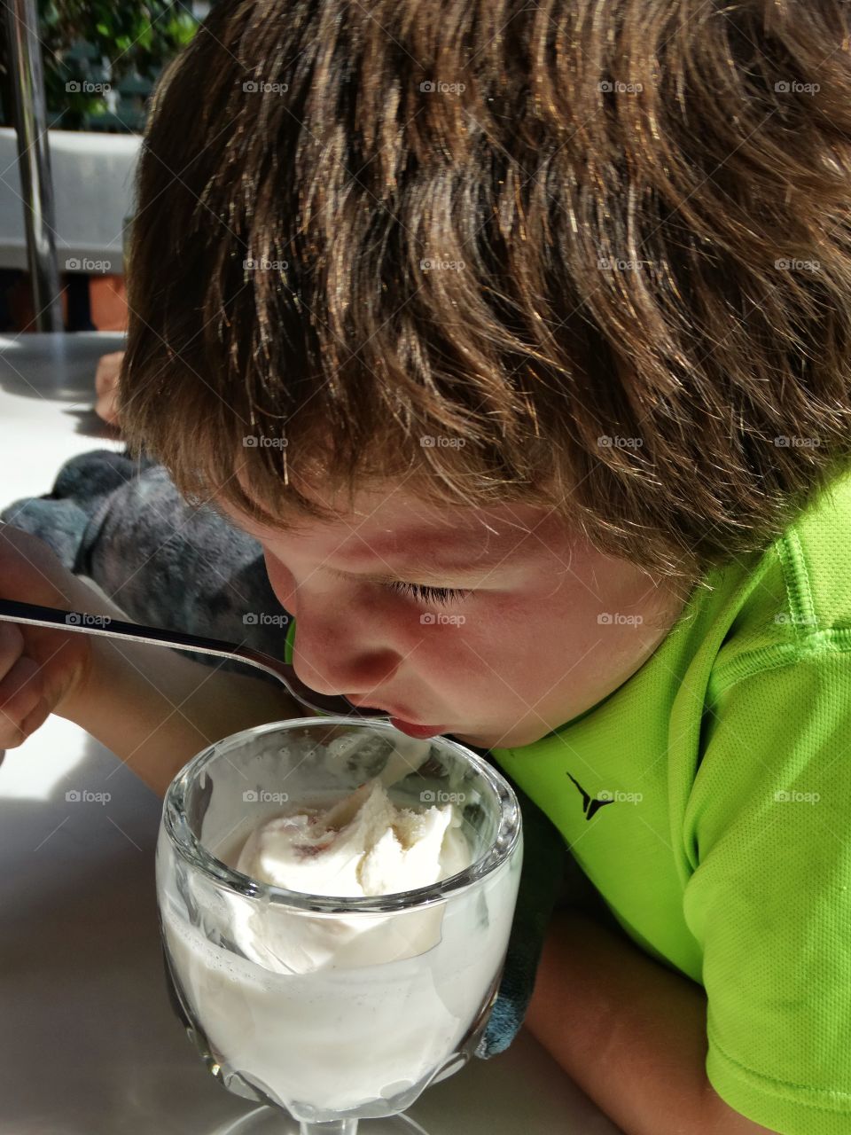 Young Boy Eating Vanilla Ice Cream
