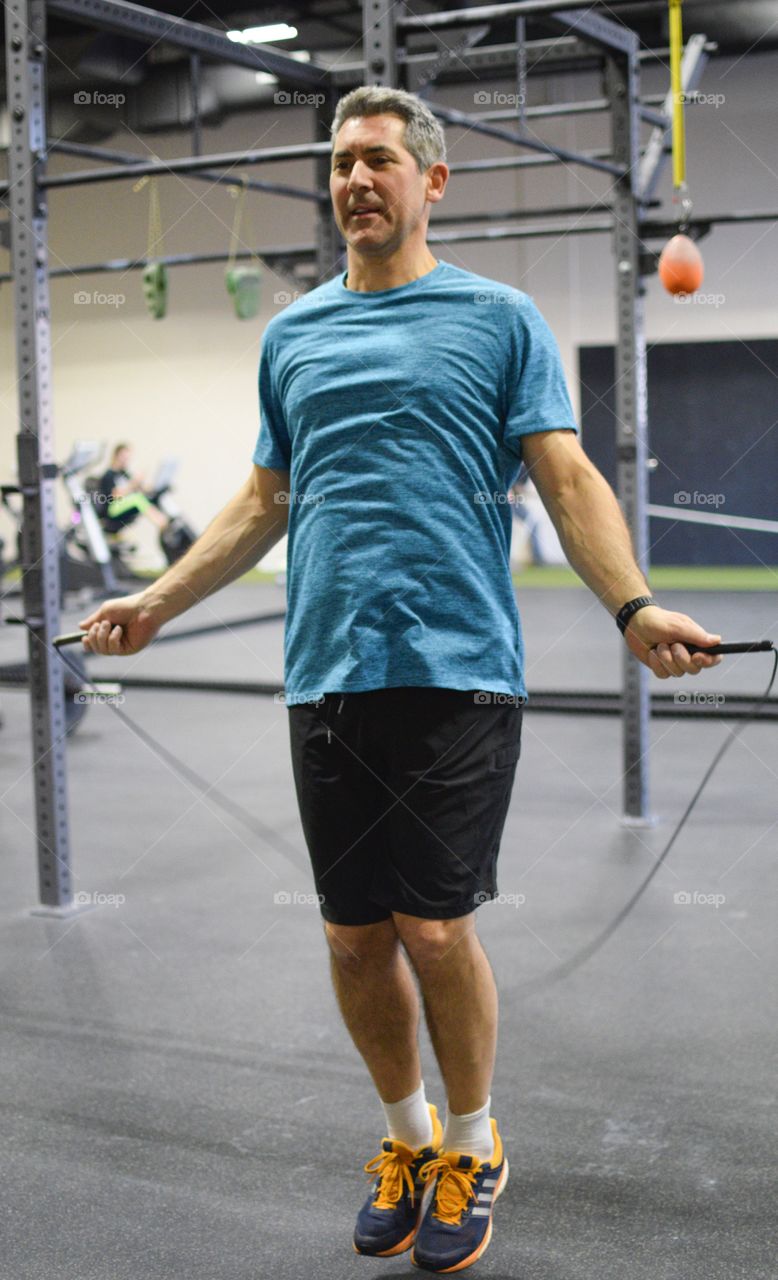 Man jumping rope at the gym