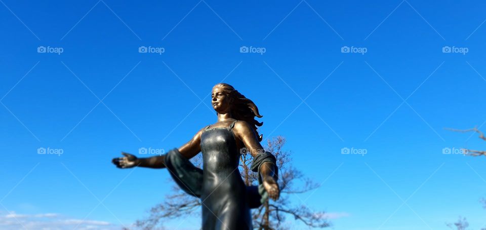 Blue sky & a statue