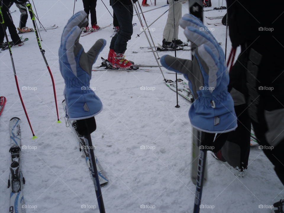 ski gloves on snow racket