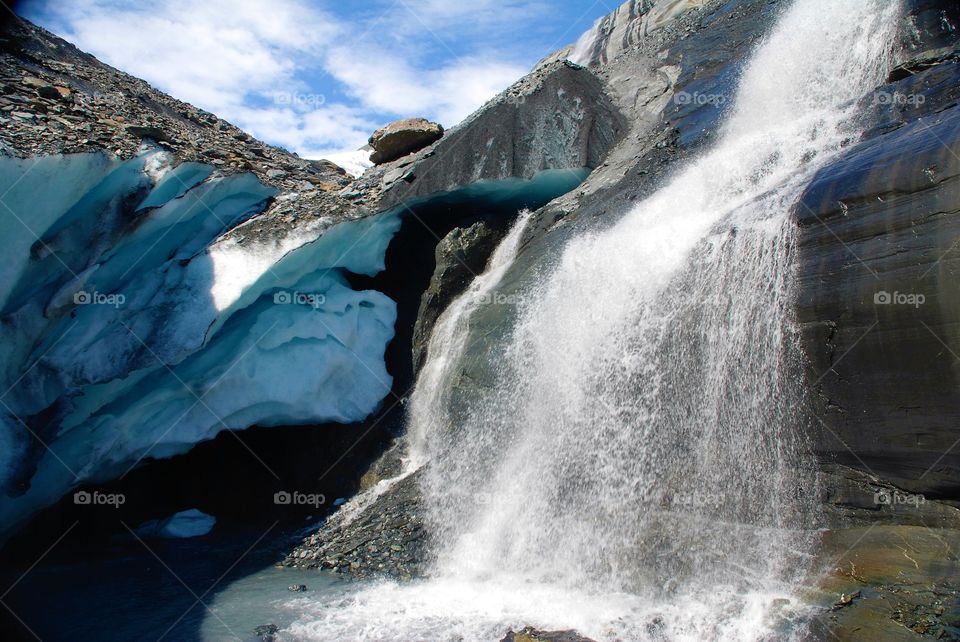 Scenic view of waterfall on rocks