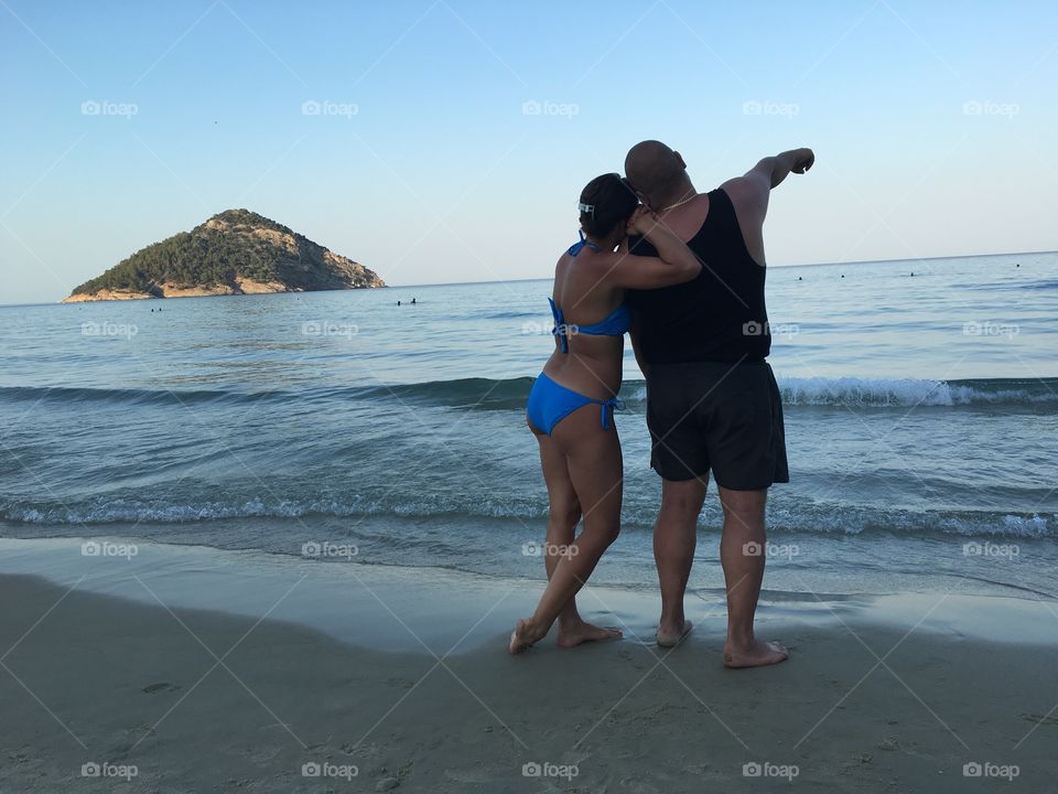 Couple on a beach at sunset