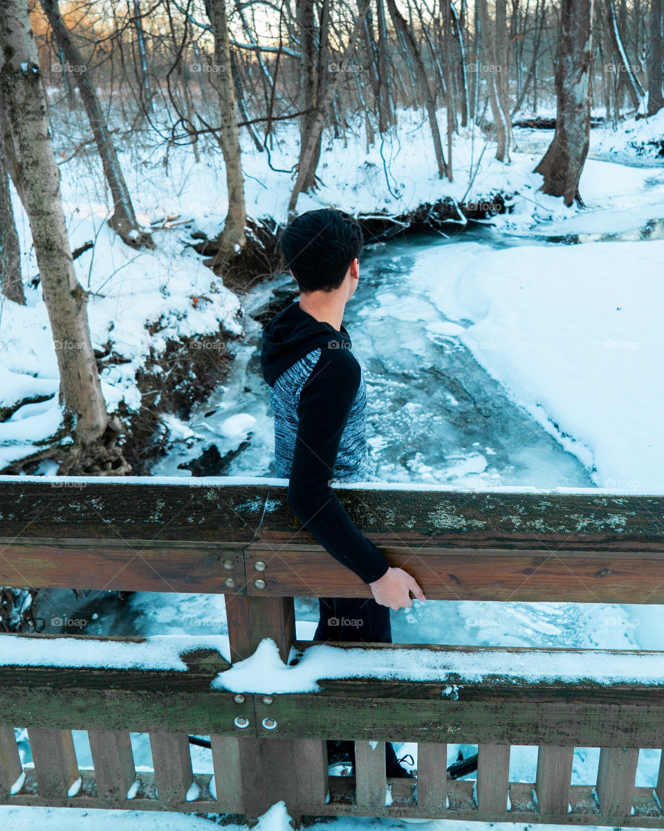 Boy on a bridge in Winter
