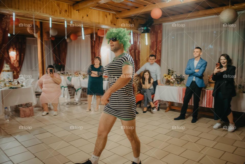 Dressing up at the wedding in funny costumes