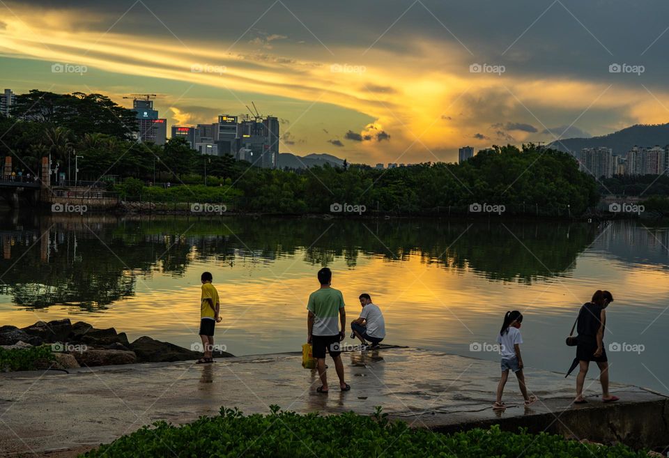 People are here to catch the beautiful glimpse of sun and sky.