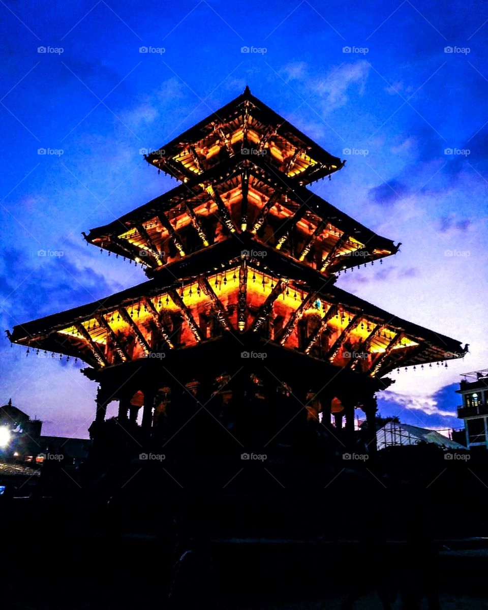 Silhouette of a pagoda style temple all lit up. It’s a gorgeous shaggy to behold!