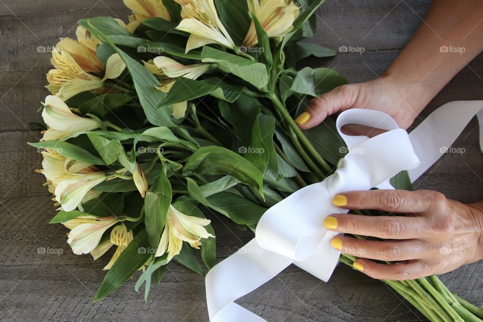 Natural nails  painted yellow with yellow flowers