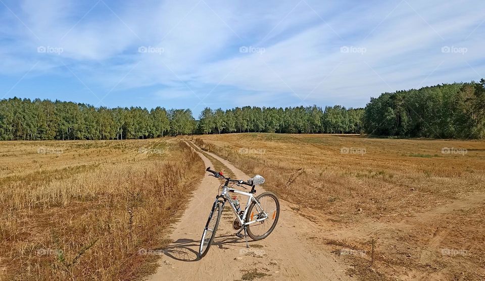 bike on a rural road countryside beautiful landscape, summer and autumn time, love riding bike