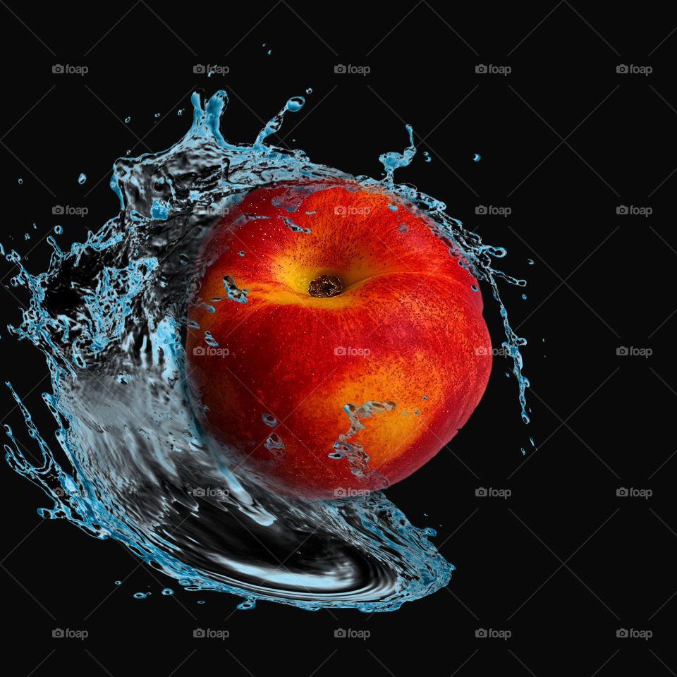 Nectarine in water splashes on Black background 2
