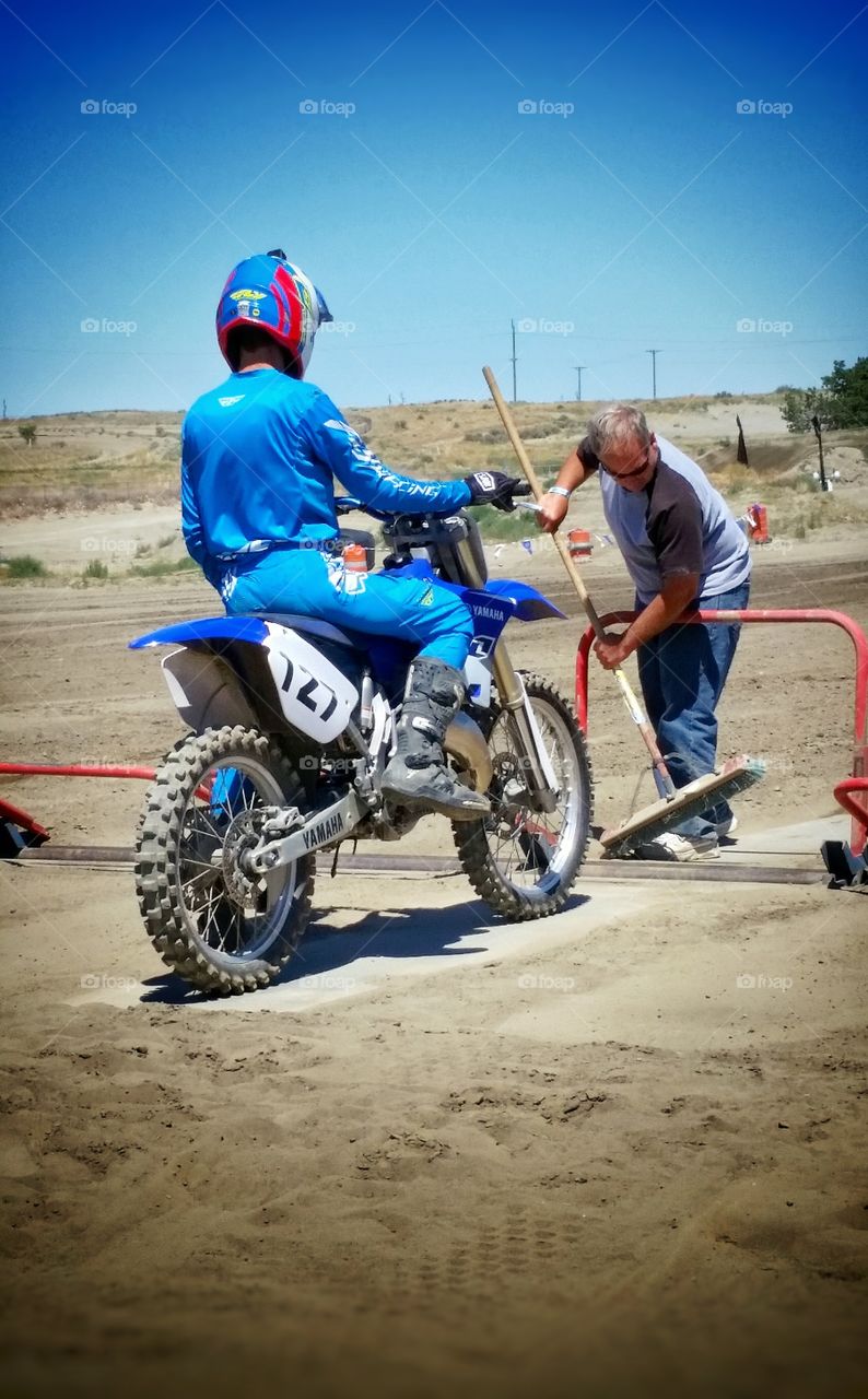 Dirt Bike Racing Dad Sweeping Starting Gate for Son