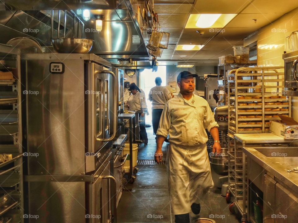 Professional Cook In Restaurant Kitchen