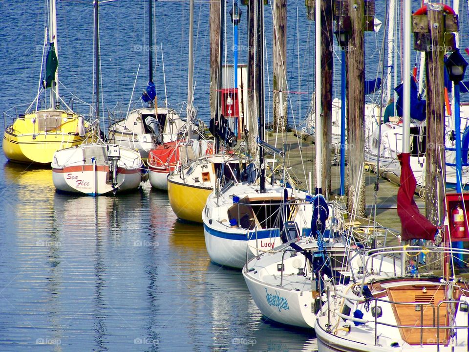 Sail boats docked at a marina 