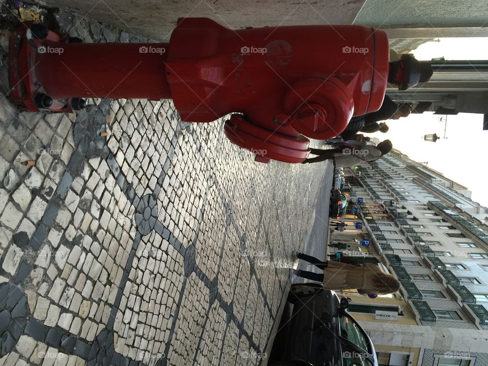 Sidewalk made of Portuguese Stones in the neighborhood of Chiado, Lisboa, Portugal