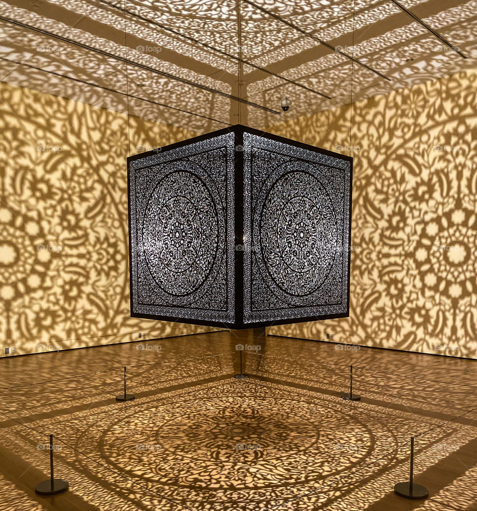 Give me light - a beautiful exhibit in a museum highlighting Indian Art. The light, shadows, lines and angles all work together to create beauty.