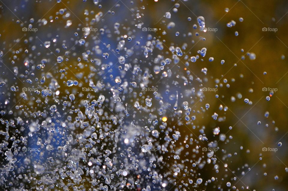 water drops on the colorful background - fountain detail