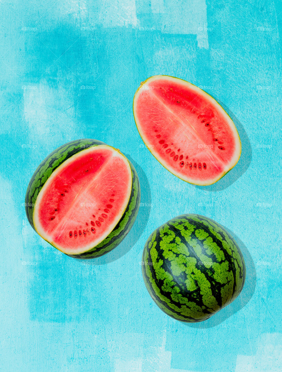 Pieces of watermelon on  background painted in blue