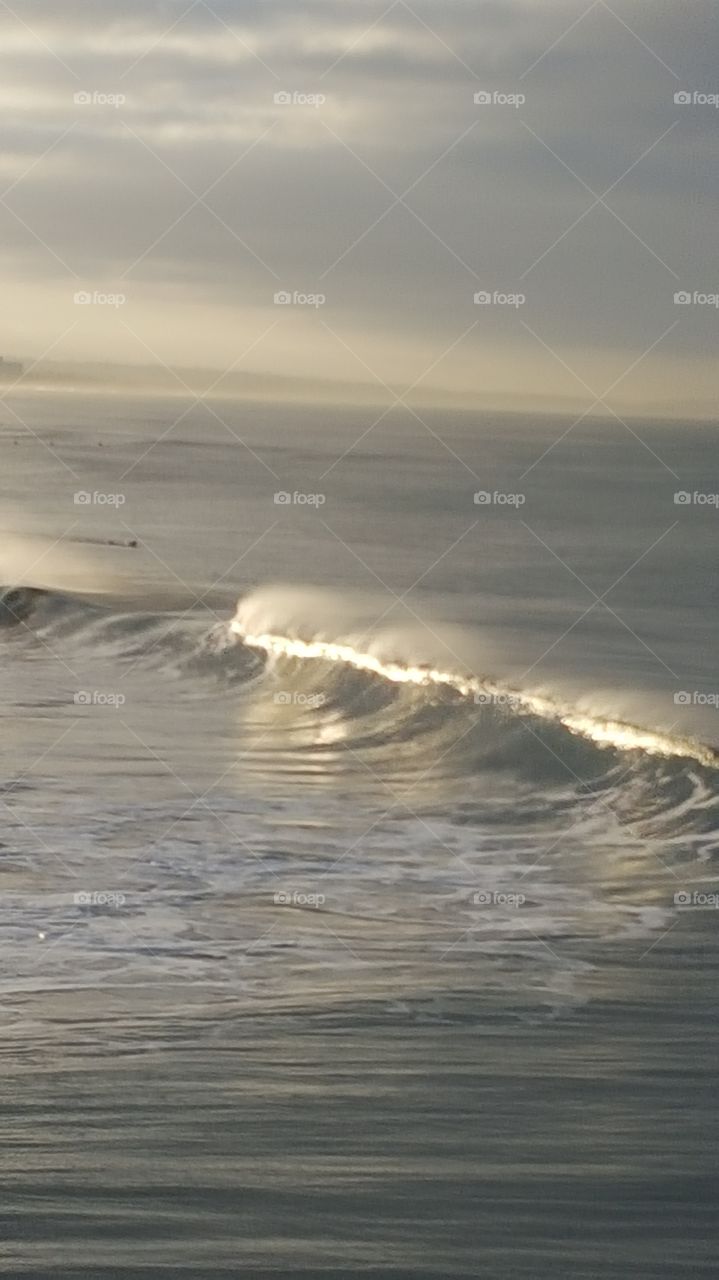 Sunrise reflection off waves