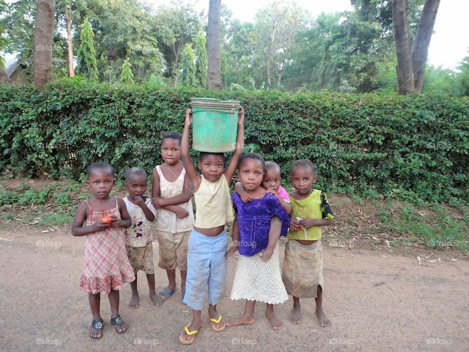 Children carrying water. Kids in Tanzania 