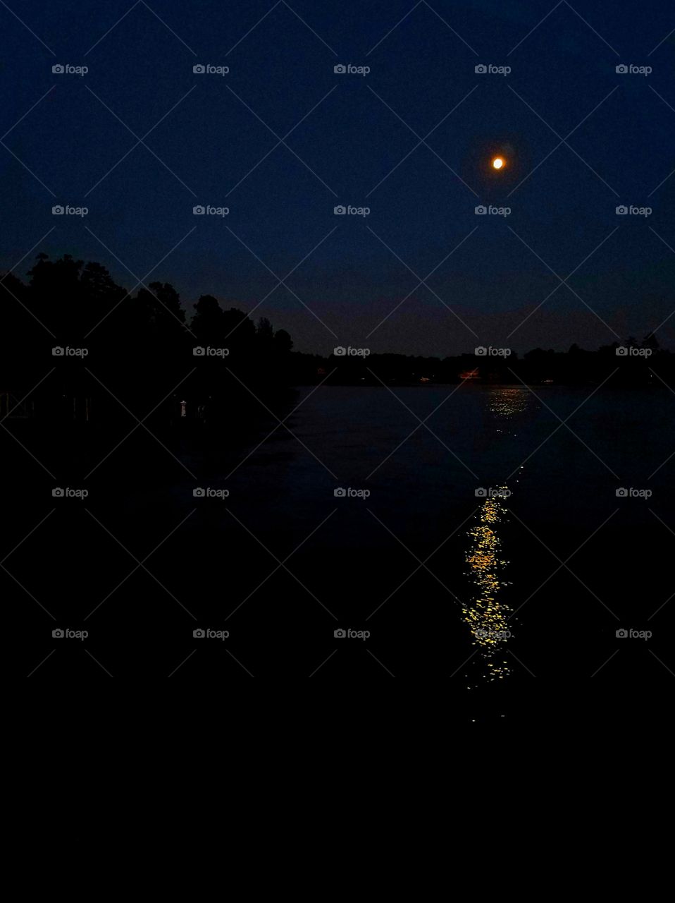 moon reflecting on lake .