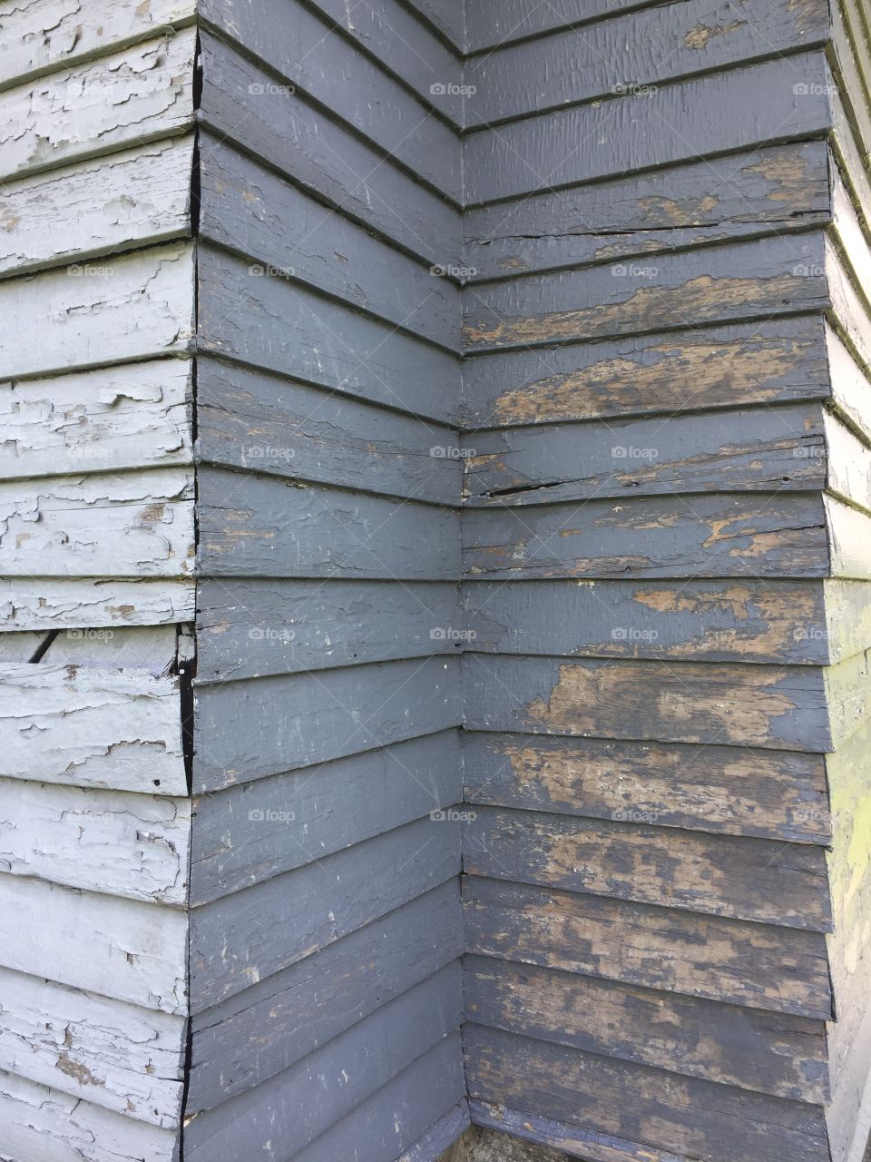 Old wood siding with worn paint