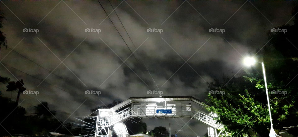 Cyclone alert named 'BULBUL' is likely to make landfall between West Bengal and Bangladesh in the early hours of sunday.An amazing early morning view captured,storm clouds swirl in the sky above the footbridge.