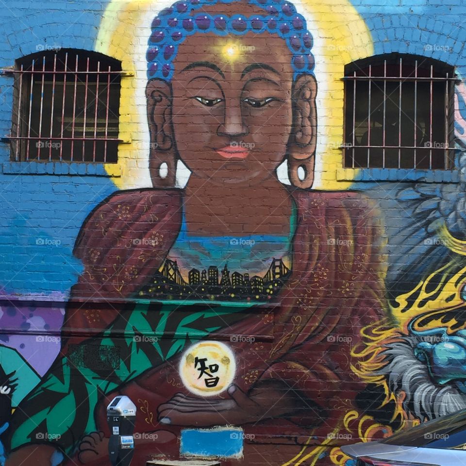 A Chinatown art mural of Buddha in San Francisco, California. 
