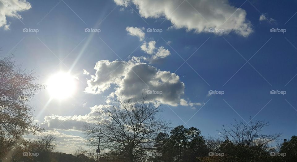 Sunny with dark clouds
