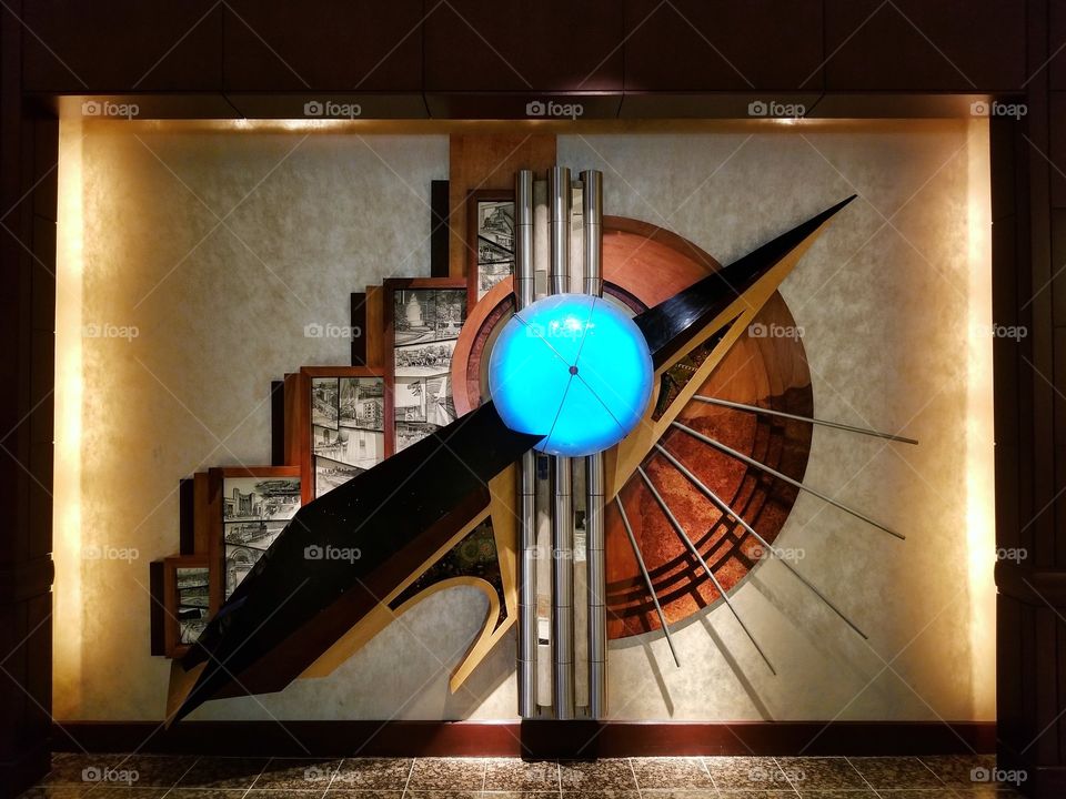 Glowing modern art sculpture on the wall inside hotel